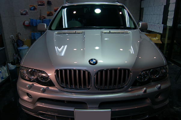 BMWEX5̃KXR[eBO